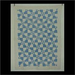 Quilt, blue and white with windmill type design. Note some light  staining. 120" x 80" $150-250