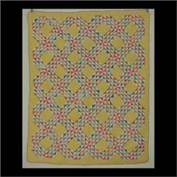 Quilt, triangular pattern with yellow and pink border. 64" x 78" $150-250