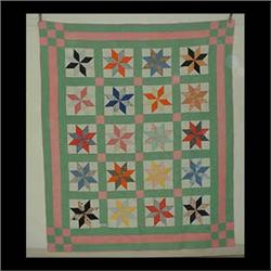 Quilt, with pink and green border of blocks star pattern. 89" x 76" $100-150