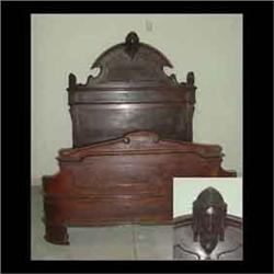 American Victorian bed in the Renaissance revival style, walnut. Carved bust surmounts cornice flank