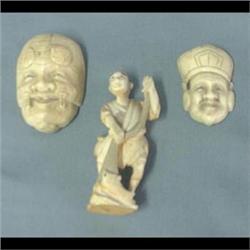 Three pieces of carved ivory. Two masks and a fisherman. 3"h  fisherman   1 3/4" and 2 1/4"  masks $