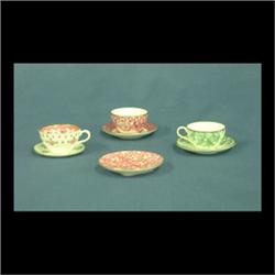 Three Spode miniature cup and saucer sets. Two red and one green.  Also, a crown Staffordshire sauce