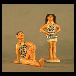Pair of Shearwater bather figures. Man and woman in blue and white  bathing suits. Both marked. Woma