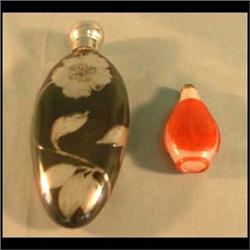 One flask and one Oriental glass snuff bottle. The snuff bottle is  red cut to clear with green top.