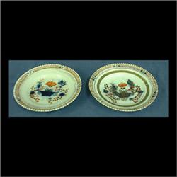 Two Russian porcelain soup plates. Quadroon-like edge. Gilded with  red and cobalt basket of flowers