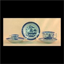 Canton cups and saucers: seven saucers, eight cups, and two  demitasse cups. Circa 1920. Trees, pago