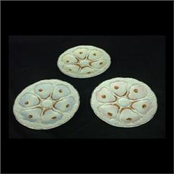 Six 6-well oyster plates. Two yellow, two pink, and two blue. No  makers' marks. 8" diameter $300-40