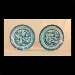 Seven Canton dinner plates. Circa 1840. Cloud rim, trees, bridge,  pagodas, and boats. Note damage.