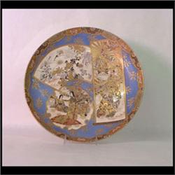 Satsuma charger. Decorated with three scenic panels on a light blue  background. One panel features