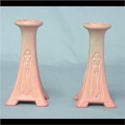 Pair of Rookwood candlesticks with a pink matte glaze. 7"h $150-250