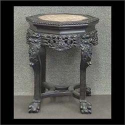 Carved Oriental plant stand, scalloped top with a pink marble  inset. 19"h x 17"d $150-200