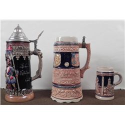 3 GERMAN STEINS-1 W/COVER-1 W/MUSIC WIND UP