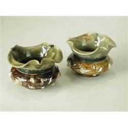 A pair of Doulton Lambeth salts with shell...