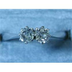 An 18ct white gold two-stone old cut diamo...