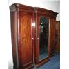 Image 1 : A Victorian mahogany triple wardrobe. 106c...