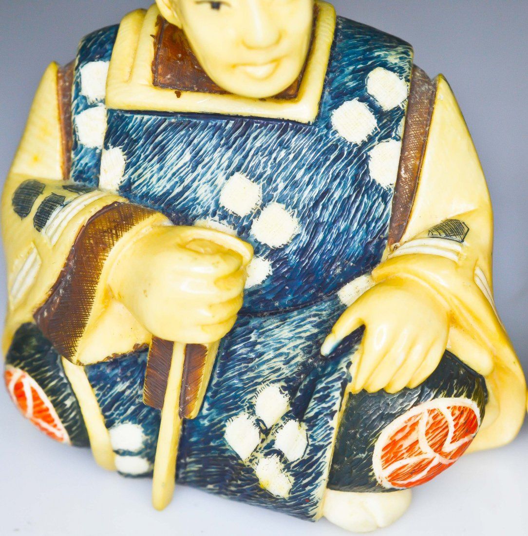 Antique Chinese pair of polychrome ivory figurines