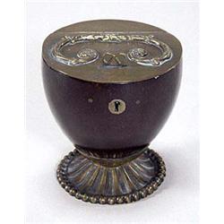 A coconut shell and metal mounted caddy, t...