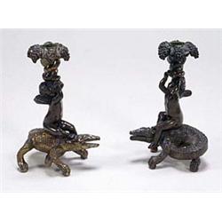 A pair of French bronze and parcel gilt ca...