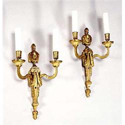 A pair of French gilt metal two branch wal...