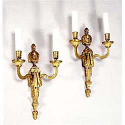 A pair of French gilt metal two branch wal...