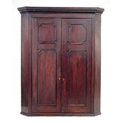 A George III mahogany hanging corner cupbo...