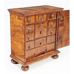 A walnut cabinet in early 18th century sty...