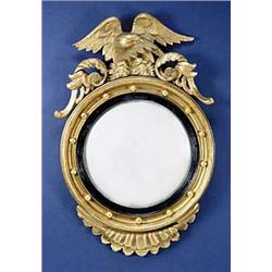 A Regency convex wall mirror, the crest wi...
