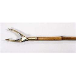 A 19th century brass and bamboo book clasp...