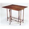 Image 1 : A mahogany rectangular spider leg table in...