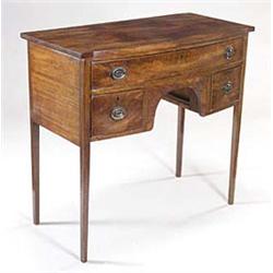 A mahogany bowfronted dressing table with...