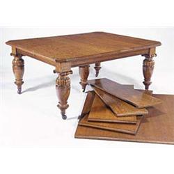 A Victorian oak extending dining table, wi...