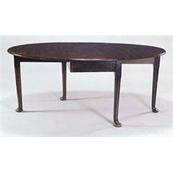 A mahogany oval drop leaf table, in George...