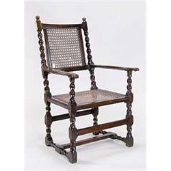 A late 17th century walnut open armchair,...