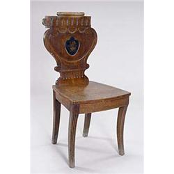 A Regency mahogany hall chair, the cartouc...