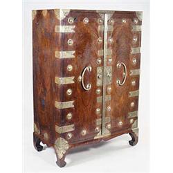 A 19th century Korean elm cabinet with bra...
