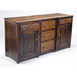 A late 18th century oak low dresser of inv...