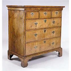 A walnut chest, the crossbanded top with a...