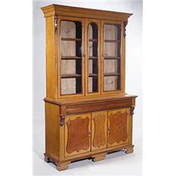 A mid 19th century oak and mahogany bookca...