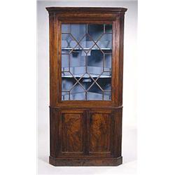 A George III mahogany standing corner cupb...