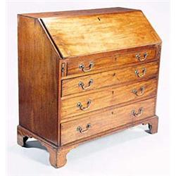 A George III mahogany bureau, the fall enc...