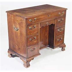 A George III mahogany kneehole desk, the r...