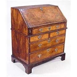 A burr walnut crossbanded and feather stru...