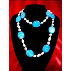 NATURAL 625 CTW KISHI WHITE PEARLS WITH BLUE CAPIZ