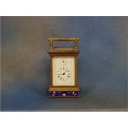 An Oriental carriage clock with enamelled...