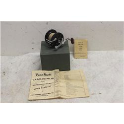 PENN REEL IN BOX WITH PAPERS