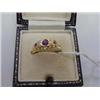 Image 1 : A lady's 18ct gold ring, set with four diamon