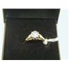 Image 1 : A lady's 18ct gold ring, set with a diamond.