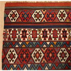A FINE ANTIQUE CAUCASIAN KELIM, the design of