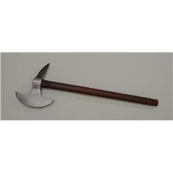 Modern copy of a hand battle axe with wood  shaft in overall good condition; a nice  decorator.  Est