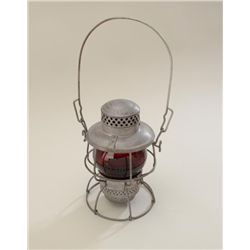 Older metal and red glass lens railroad  lantern by Adlake in very good condition with  long metal h